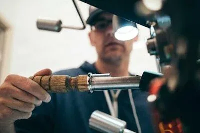 Mechanic using diagnostic tools on a car engine