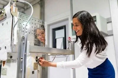 Technician testing automotive electrical components